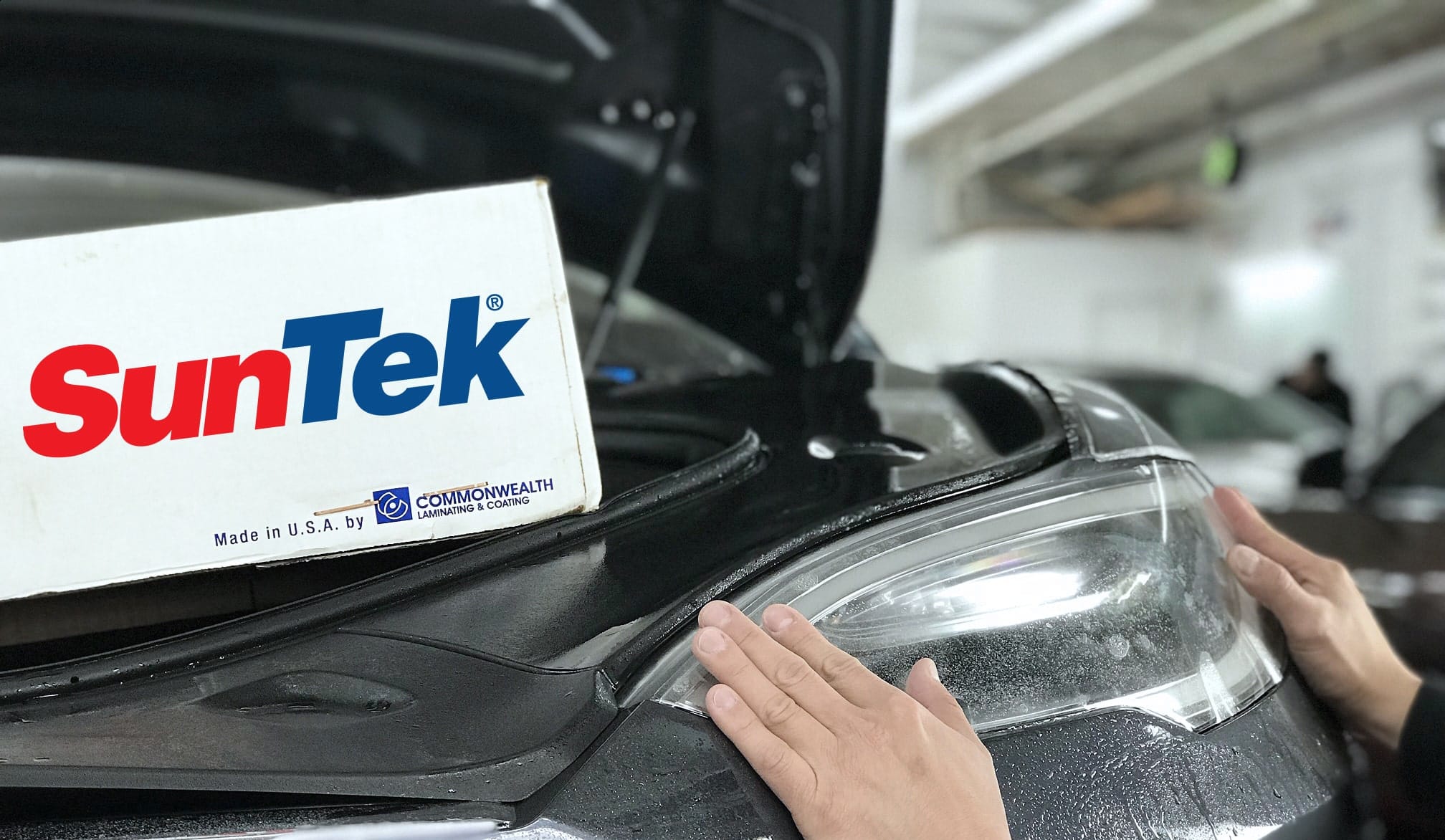 Logo of suntek on a car